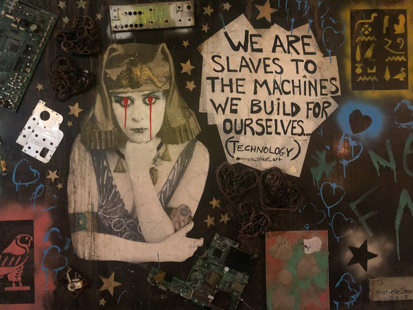 Stylized woman with red tears surrounded by electronics and a quote about technology.